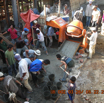 Cement mixing and rubber baskets are waiting to be filled with concrete mixture